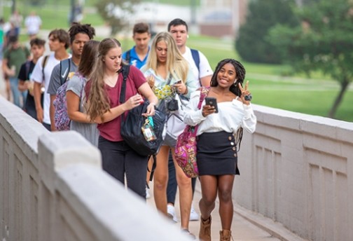 Students standing on bridge.