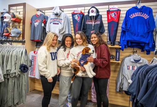 Students show off gear in the campus bookstore
