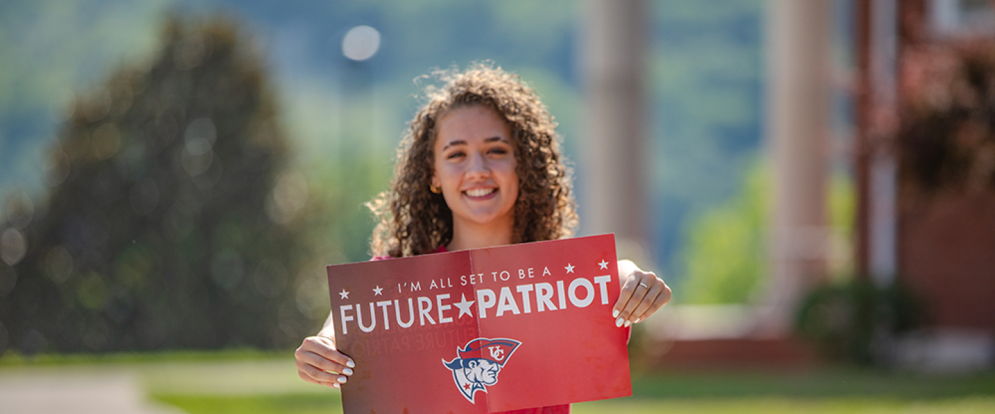Student holding Future Patriot packet