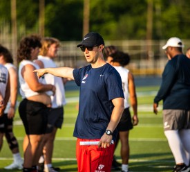 Football coach directing players