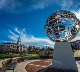 A picture of the campus showing the globe statue 